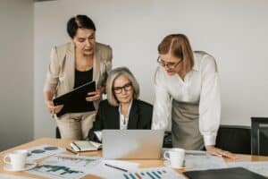 Professional business women working on finance reporting