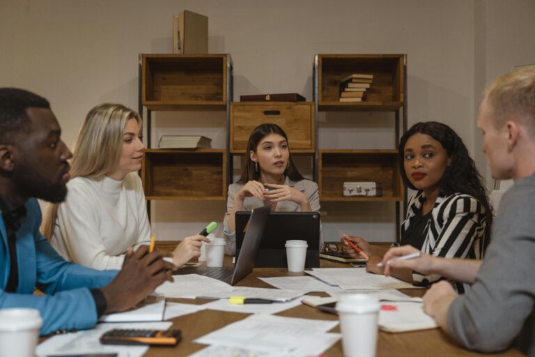 Business team reviewing financial reports with a fractional financial controller for growth planning
